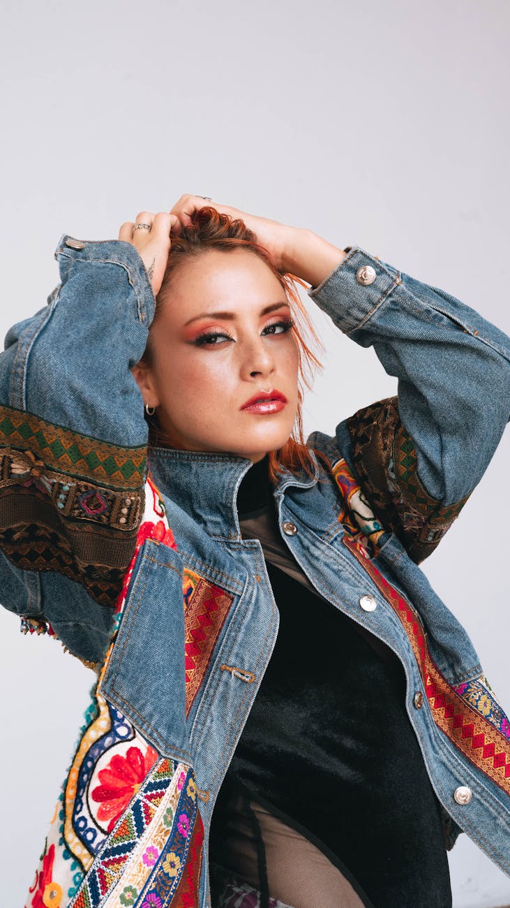 model in a denim jacket with embroidered inserts